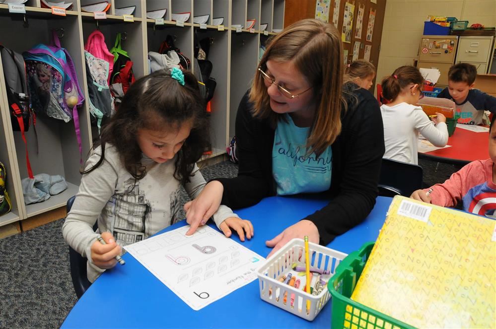 kindergarten teacher and student studying kindergarten teacher and student studying
