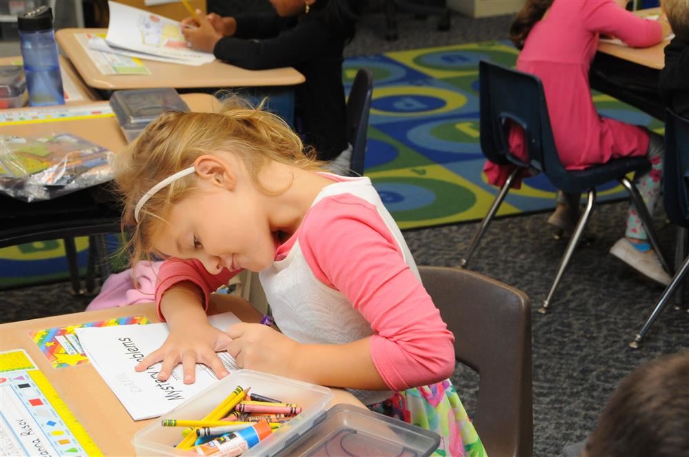 young girl doing art