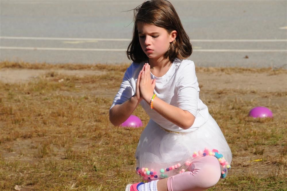 girl doing yoga outside