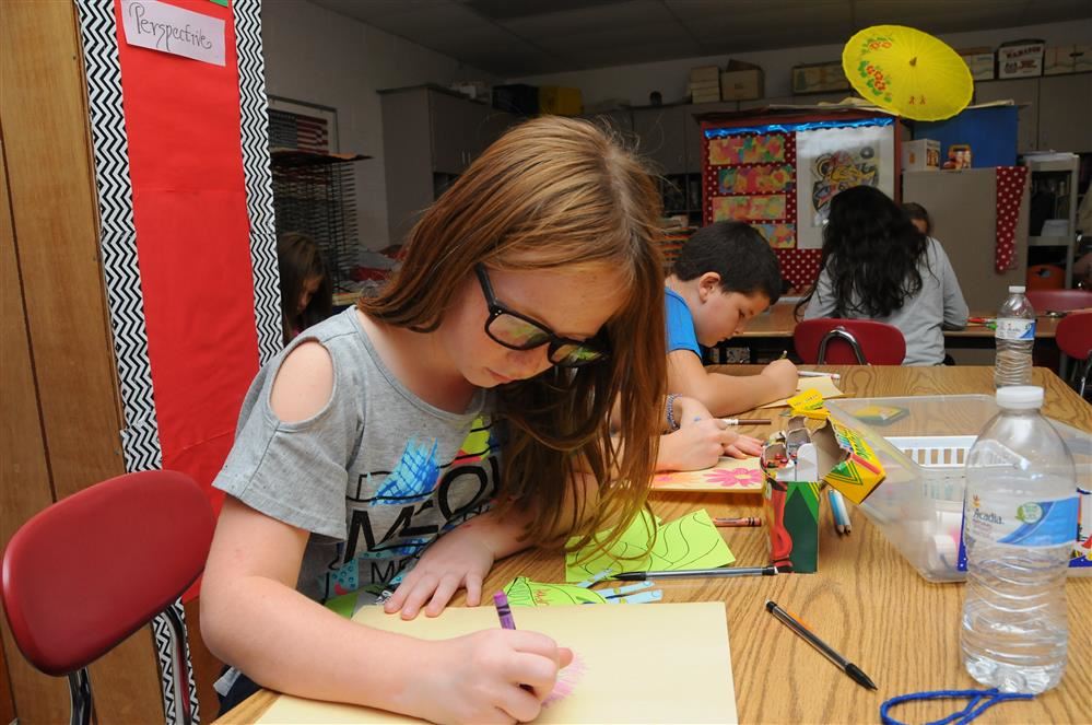 female student doing art